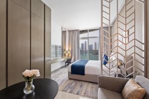 Posezení v ubytování Aliving Stylish Studio at DAMAC Prive with Balcony and Partial Burj Khalifa View-1315 + 16 fotografií