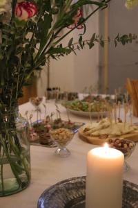 a table with a candle and plates of food at Konak Bergama in Bergama +14 photos