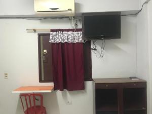 TV i/ili multimedijalni sistem u objektu Don Carmelo Hotel