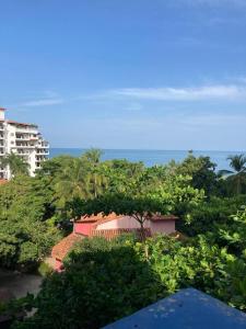 a view of the ocean from the balcony of a resort at Apartment Bello Horizonte in Santa Marta
