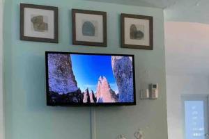 a flat screen tv hanging on a wall at Apartamentos en VIQUES Puerto Rico in Vieques