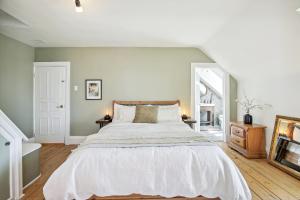 a bedroom with a large bed and a mirror at Castel Beaupré in Chateau Richer +18 photos