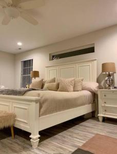 a bedroom with a large white bed and a window at Cozy Virginia Beach Vacation Home in Virginia Beach