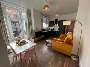 a living room with a couch and a table at Flat 2, 297 Gillott Road, B16 0RT in Birmingham