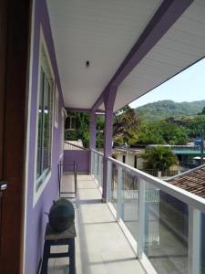 a balcony of a house with a view at Apartamento kit aconchegante 1 in Matinhos