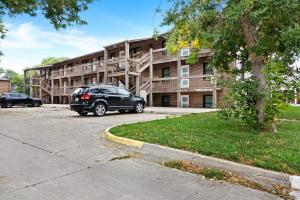 a black suv parked in front of a building at Chic & Cozy Condo in Manhattan with Free Parking & WiFi in Manhattan