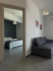 Postel nebo postele na pokoji v ubytování Riposto Etna Taormina Mare