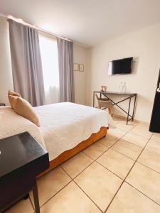 TV a/nebo společenská místnost v ubytování Suites ciento 37