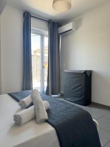 Postel nebo postele na pokoji v ubytování Riposto Etna Taormina Mare