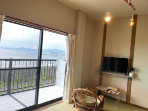 TV a/nebo společenská místnost v ubytování 民宿たかはま Takahama Guest house