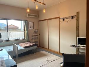 Televisyen dan/atau pusat hiburan di 民宿たかはま Takahama Guest house