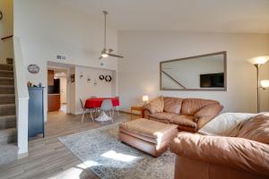 a living room with a couch and a table at Flagstaff Townhome with Grill about 3 Mi to Downtown! in Flagstaff