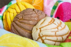a plate of cookies and other pastries and chips at LOL-HA Hotel Boutique in Cancún