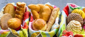 a bunch of pastries in a basket on a table at LOL-HA Hotel Boutique in Cancún