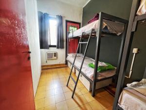 Ένα ή περισσότερα κρεβάτια σε δωμάτιο στο Lacandona Hostel +57 φωτογραφίες
