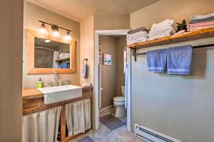 a bathroom with a sink and a toilet at Modern Mountain Retreat with Views Ski, Golf and Hike in Angel Fire +22 photos