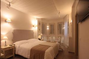 Letto o letti in una camera di Relais in Contrada