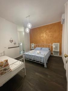 Postel nebo postele na pokoji v ubytování Civico 210