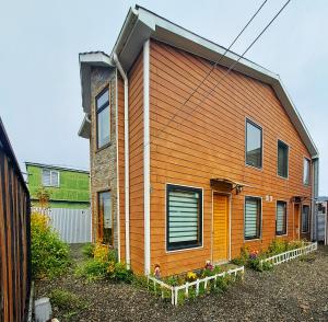 a house with an orange at cabañas el rancho in Puerto Natales