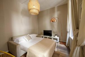 Postel nebo postele na pokoji v ubytování The right place 4U Grotte Apartment