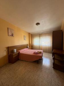 Ένα ή περισσότερα κρεβάτια σε δωμάτιο στο Hostal Pensión LA TORRE +8 φωτογραφίες