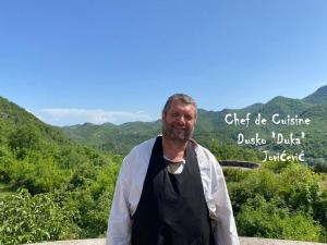 a man standing on top of a mountain at Skadar Lake Family Resort in Rijeka Crnojevića