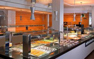a buffet line with many different types of food at Hotel RH Royal - Adults Only in Benidorm