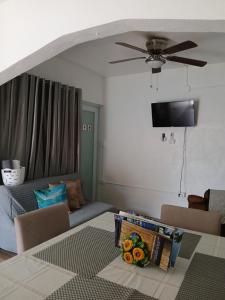 a living room with a couch and a table at Casa Costa Sur in Vieques