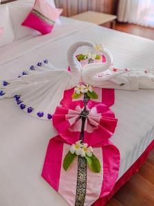 Voodi või voodid majutusasutuse Smile Samui Chaweng Beach Front Resort toas