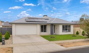 a house with solar panels on the roof at Popular Villa Shepparton in Shepparton