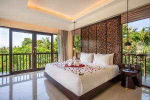 Postel nebo postele na pokoji v ubytování Sanctoo Suites & Villas