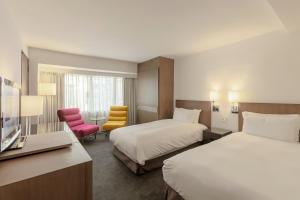 Postel nebo postele na pokoji v ubytování United Hotel