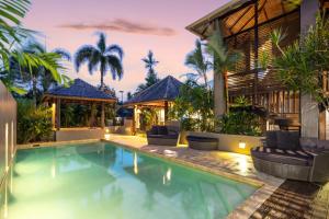 an image of a swimming pool in a villa at 35 Beachfront Mirage Port Douglas in Port Douglas