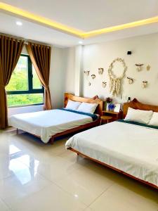 Postel nebo postele na pokoji v ubytování À Ơi Home - Venuestay