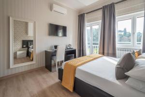 Postel nebo postele na pokoji v ubytování Happy Holiday in Rome b&b