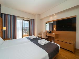 Postel nebo postele na pokoji v ubytování Elektra Hotel & Spa + 22 fotografií