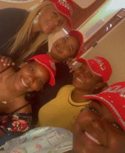 four women wearing red hats posing for a picture at Babes & Breakfast in Juan López +3 photos