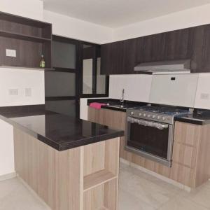 Η κουζίνα ή μικρή κουζίνα στο Casa frente a alberca +10 φωτογραφίες