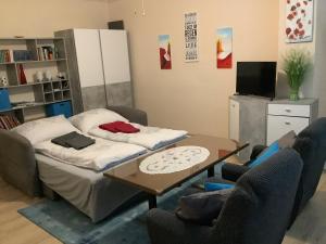 Televízia a/alebo spoločenská miestnosť v ubytovaní Ferienwohnung Casa Flora