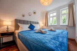Postel nebo postele na pokoji v ubytování SCHLOSSBERG RESIDENCES - Markplatz City-Apartment