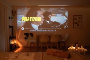 a bedroom with a large projection screen in a room at Superb Modern Studio Leukerbad in Leukerbad