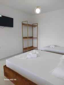 Ένα ή περισσότερα κρεβάτια σε δωμάτιο στο Leli Apartments