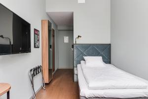 Ένα ή περισσότερα κρεβάτια σε δωμάτιο στο Home Hotel Post