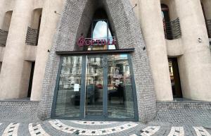 a entrance to a building with a glass door at Optima Collection Dnipro in Dnipro