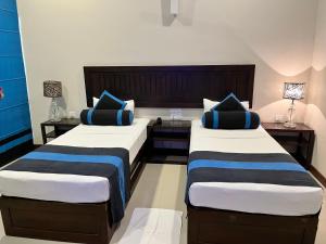 Letto o letti in una camera di Hotel Randiya Anuradhapura
