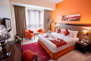 Icon Delux Hotel Apartments Al Barsha - Formerly Abidos客房内的一张或多张床位