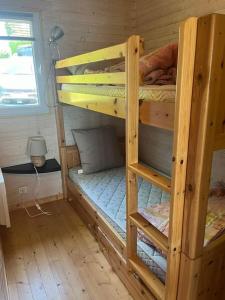Postel nebo postele na pokoji v ubytování Chalet les pieds dans l'eau