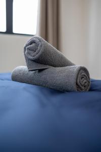 Ένα ή περισσότερα κρεβάτια σε δωμάτιο στο The Sun Executive #BayanLepas #QueensbayMall #8