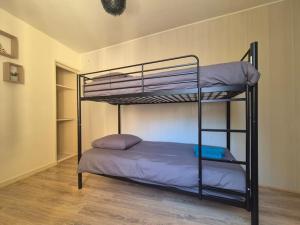 a bedroom with two bunk beds in a room at #L'Instant#Terrasse #Thiers# in Thiers