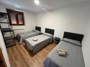 Postel nebo postele na pokoji v ubytování Casa en Rabanera del Pinar